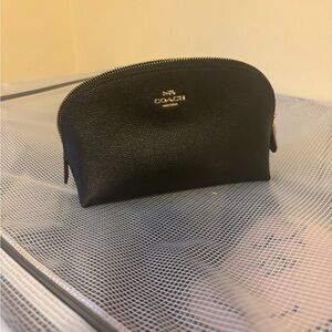 Coach Black Leather makeup pouch.